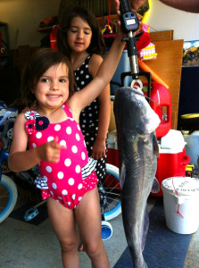 Natalie Batten holding the huge catfish she caught on Boltz Lake over Memorial Day weekend. Her sister Lilly is in the background. (photo submitted)