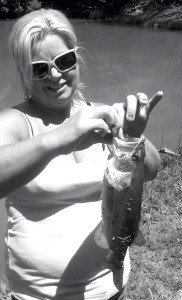 Sherry Molton holding a bass caught on Grayson Lake. (photo submitted).