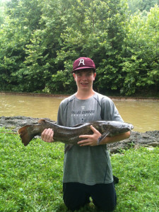 Dan Busch holding a flathead catfish he caught and released at Beech Fork Lake, W.Va. on Sept. 14. It was 33 inches and 17 lbs. Dan is a freshman at Paul Blazer High School. (photo submitted).