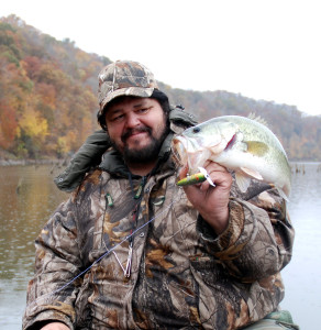 Author Chris Erwin holding a fall bass caught on Cave Run Lake in October 2012. (Photo by Christina Erwin)