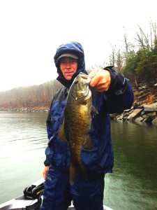 Scott Doan holding a smallmouth caught in the dam area of Cave Run Lake last week. (Photo submitted).
