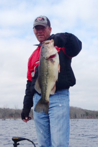 Scott Doan holding a 22 inch Largemouth bass caught on Cedar Creek Lake Dec. 2. (Photo submitted)