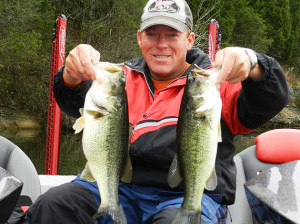 Scott Doan holding two bass caught Nov. 11 at Cedar Creek Lake on an "A" rig. (Photo submitted.)