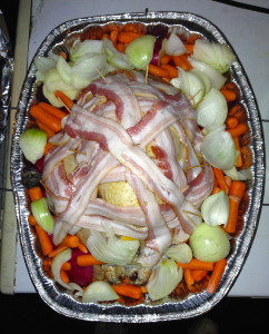 The turkey ready to go in the oven. The bird then is covered with two layers of foil. Preheat your oven to 325 degrees. (Photo by Chris Erwin).