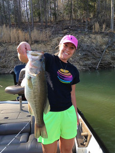 Kyrstin Johnson holding her 5.75-pound largemouth bass caught on Cave Run Lake April 19. (Photo by Scott Doan)