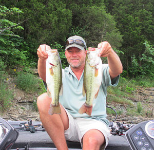 Scott Doan holding two nice bass caught last week at Cedar Creek Lake. (photo submitted)