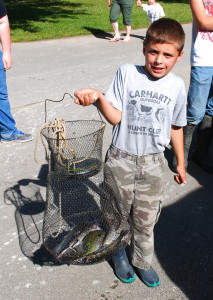 Graysen Cormichael  showing off his mixed bag of catfish,bass and bluegills (photo by Chris Erwin)