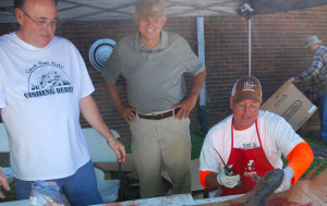 Members of the Kentucky Houndsman Association ran the fishing cleaning booth, so the kids could take their catch home with them. (photo by Chris Erwin)