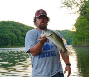 Scott Erwin holding one of the bass caught on Cave Run while fishing Memorial Day weekend. (Photo by Chris Erwin)