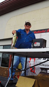 George Smith Holding a bass caught from the Ohio River during the Military Tournament