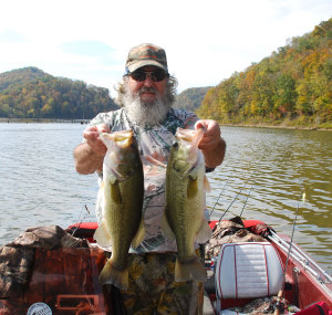 Larry Kitchen holding two bass over 20 inches caught during the three days he fished with author Chris Erwin. (Photo by Chris Erwin)