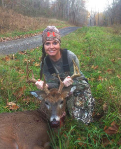 Dana Patton displaying her 10-point buck taken the second day of gun season. (Photo submitted)