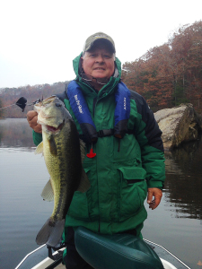Greg Dowdy holds a 6 1/2 lb largemouth bass caught from Grayson Lake this past week. (Photo submitted). 