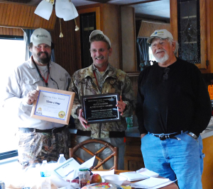 Chris Erwin and Soc Clay present two awards to Tom Clay for his work in expanding media markets to outdoor writers. (Photo by Linda Erwin)