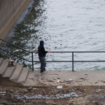 A local fisherman trying his luck at fishing the forward wall at the Greenup Dam on the Ohio side of the river. (Photo by Chris Erwin)