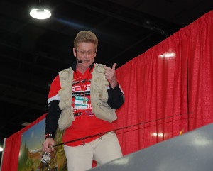 Local TV and radio host Tom Clay works the fish tank at the Cincinnati Boat, RV and Travel show this past weekend. (Photo by Chris Erwin)