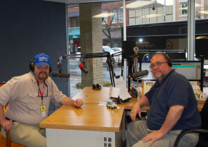 Jim Forrest and Chris Erwin getting ready to do the first outdoor segment for the show "Let's Talk Sports" on 105.7 Koolhiits WLGC. (Photo by Linda Erwin)