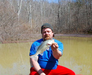 Scott Erwin holding the second of three fish caught on Yatesville lake Sunday while the water was eight feet over summer pool. (Photo by Chris Erwin)