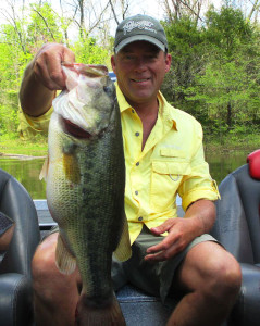 Scott Doan gipping and grinning with his 7.26-pound bass caught from Cedar Creek Lake in late April. (photo submitted)