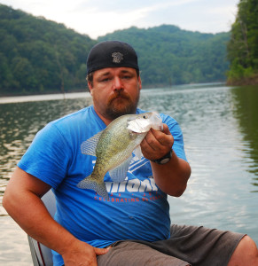 Scott Erwin holding one of 15 crappie caught on crankbaits fishing Cave Run Lake Aug. 9. (Photo by Chris Erwin)