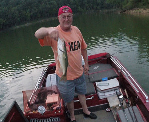 Kenny Edmonds holding one of the dozen fish caught while fishing Cave Run Lake in Morehead Ky. (Photo by Chris Erwin)                       