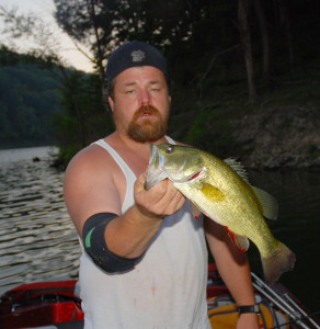  Scott Erwin holding a good bass caught on Cave Run Lake using a crankbait and fishing downed trees