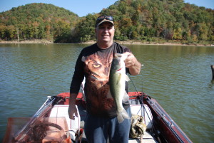 Larry Kitchen holding one of the many bass caught while using crankbaits and spinnerbaits