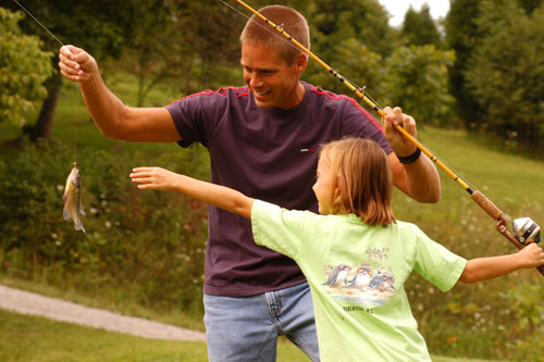 Church Saufley helps his stepdaughter Morgan land a bluegill from a small pond in Shelby County. Jimmy Houston, well known professional angler and host of the “Jimmy Houston Outdoors” television show, gives some tips on teaching young people how to fish.